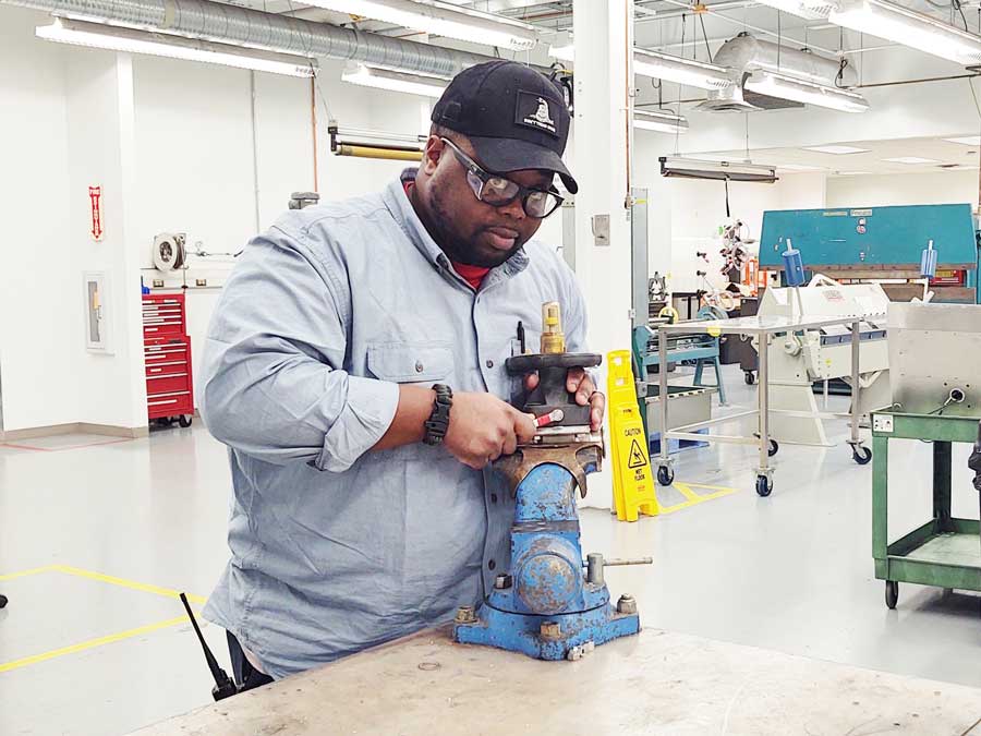 Click to enlarge,  Marvin Lewis is one of three individuals participating in the Pfizer apprenticeship program through Central Carolina Community College. 