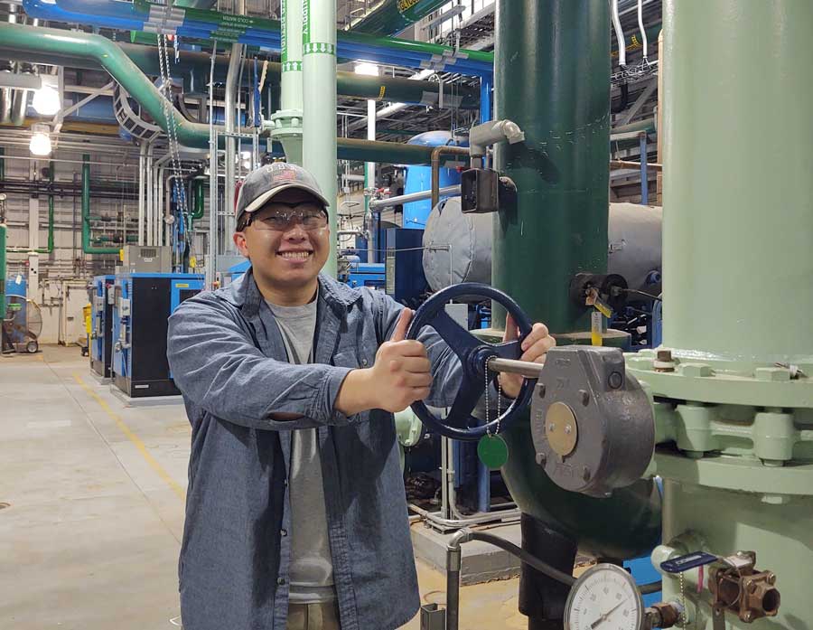 Click to enlarge,  Brandon Yang is one of three individuals participating in the Pfizer apprenticeship program through Central Carolina Community College. 