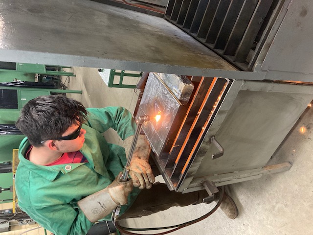 Click to enlarge,  Dylan Smith at work on a welding project. 