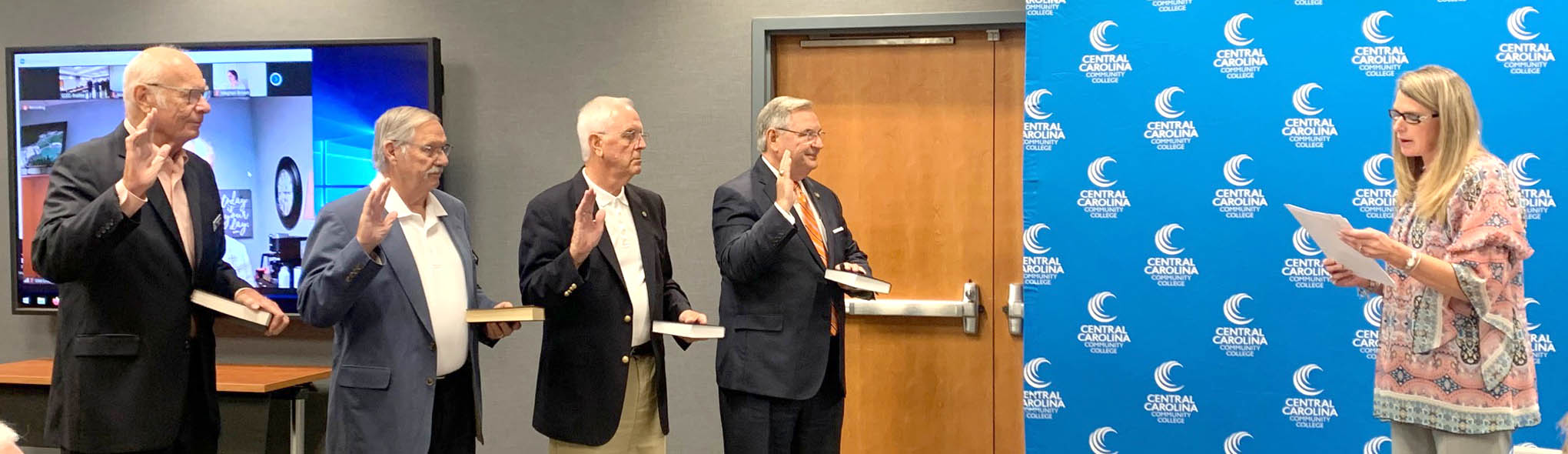 Click to enlarge,  Central Carolina Community College's reappointed Trustees were sworn in at the CCCC Board of Trustees' meeting on Wednesday, July 28. Susie K. Thomas (right), Clerk of Superior Court in Lee County, conducted the ceremony. Being sworn in were, left to right: Trustees George Lucier, Bill Tatum, Gordon Springle, and Jim Burgin. 