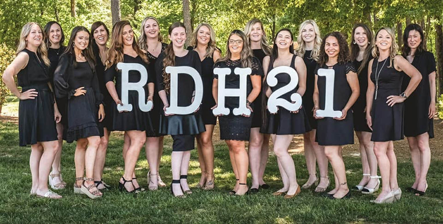 Click to enlarge,  Members of the Central Carolina Community College Dental Hygiene Class of 2021 - with home county listed -- are pictured, left to right: Amy Hargis (Johnston), Tess Thomas (Moore), Kennedy Clayton (Lee), Anna Daniel (Moore), Katie Mastromonaco (Lee), Brittany DiBernard (Wake), Mallory Scarboro (Moore), Sabrina Tillman (Lee), Monica Cuevas (Lee), Riki Nunnery (Cumberland), Brandy Plewniak (Wake), Peyton Sprouse (Lee), Alisha Neal (Lee), Meagan Little (Lee), Brittany Temple (Wake), and Aki Takemoto (Orange). The CCCC Dental Assisting program is ranked as the No. 1 Best Dental Hygiene Program in North Carolina - 2021 by NursingProcess.org. For more information on the CCCC Dental Hygiene program, visit www.cccc.edu/curriculum/majors/dental/hygiene/. 