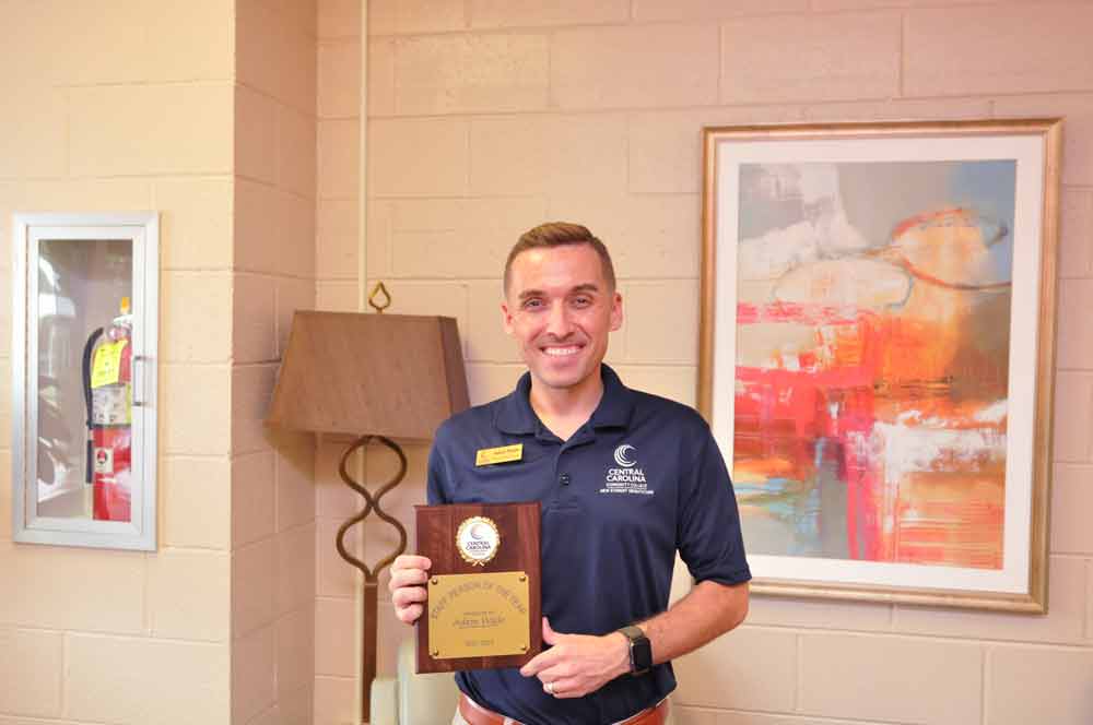 Click to enlarge,  Adam Wade has received the Central Carolina Community College Staff Person of the Year Award. Mr. Wade, who was recognized at the recent CCCC Convocation program, is CCCC Director of Admissions. 