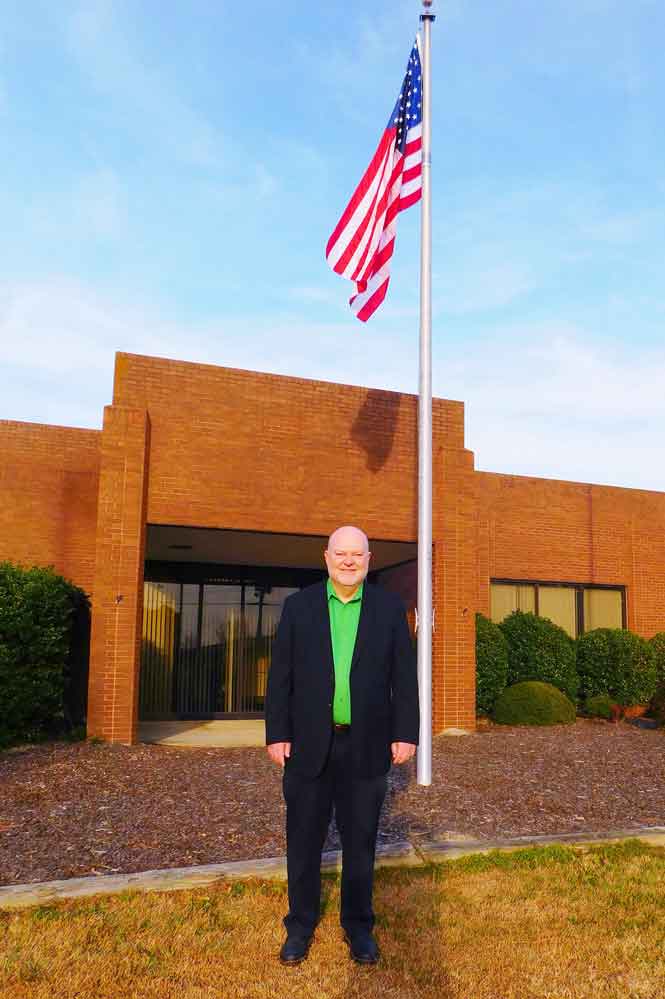 Click to enlarge,  Central Carolina Community College alumnus E. Eugene Moore is being recognized for his $2 million gift to his alma mater with the naming of the future E. Eugene Moore Manufacturing and Biotech Solutions Center in his honor. Here, Moore is pictured in front of the future Center. 
