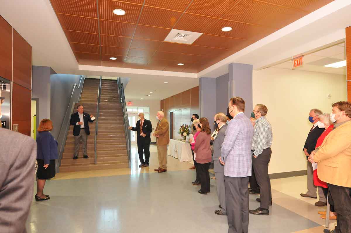 Click to enlarge,  Kirk J. Bradley (standing on stairway) addresses a portion of the guests who attended a celebration at Central Carolina Community College's Chatham Health Science Center (CHSC) in recognition of the naming of the Kirk J. Bradley Student Center. 