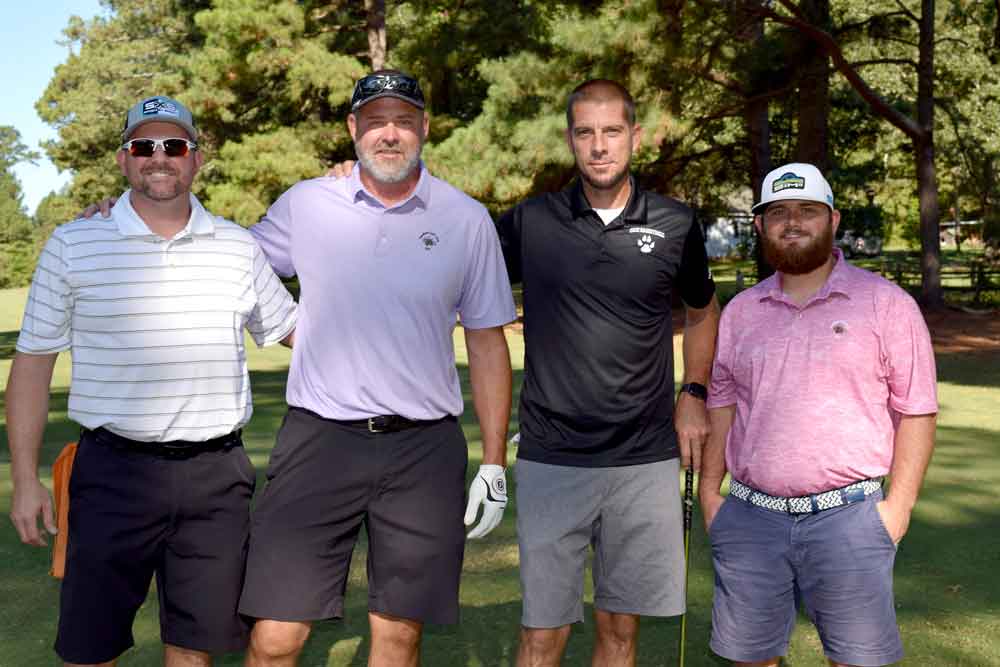 Click to enlarge,  Members of the A.M. shotgun first-flight first-place team were Brad McDougald, Marty Talbert, Chris Maples, and Todd Matthews. 