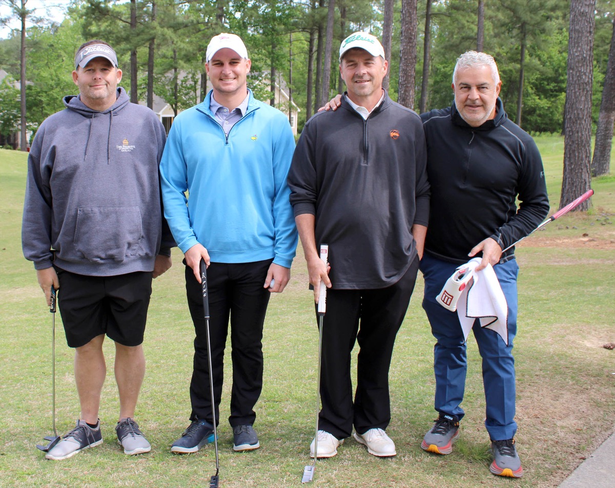Click to enlarge,  The team of Amir Ansari, Chad McDowell, Rich Felch, and Corey Hassell -- sponsored by Holmes Companies - finished first in the first flight (morning round) in the 10th Central Carolina Community College Foundation Chatham Golf Classic May 3 at The Golf Club at Chapel Ridge. 